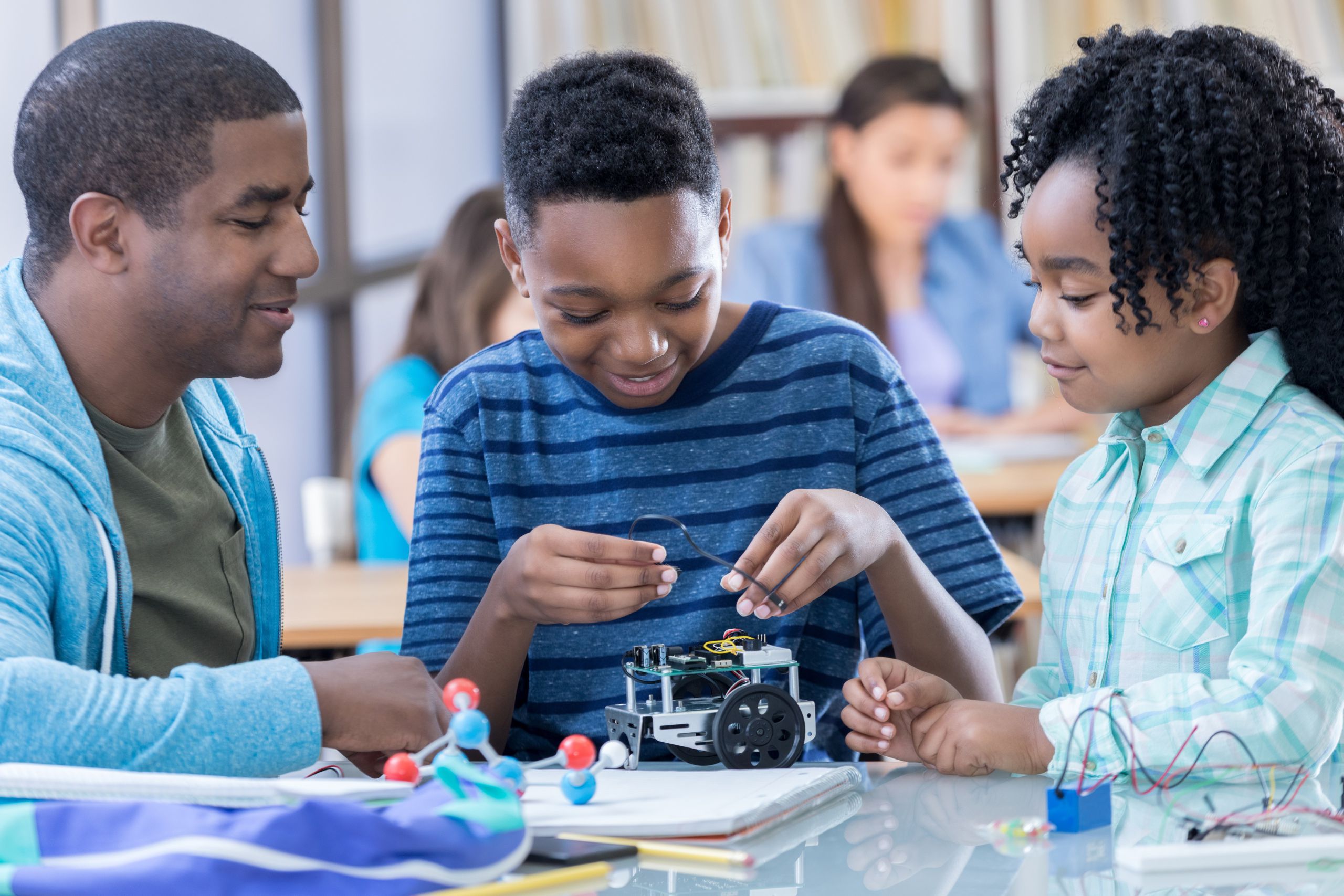 STEM mentor assisting mentees