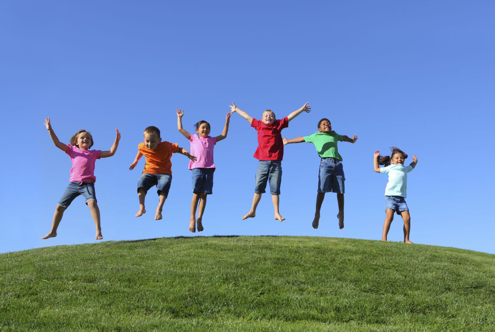 Elementary students jumping